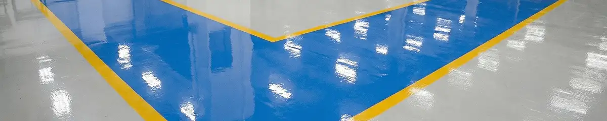 A factory floor professionally covered and marked with epoxy flooring in Baton Rouge, LA