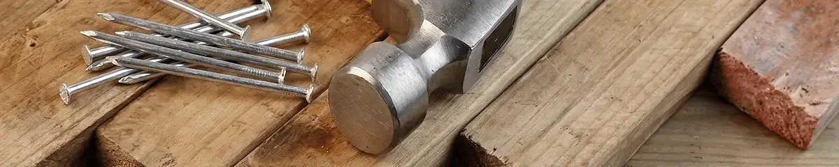 Hammer and nails on hardwood flooring boards in Baton Rouge, LA