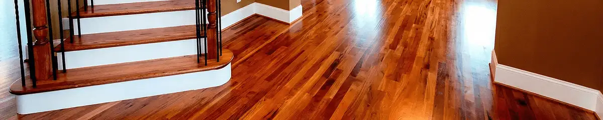 Base floor of a staircase with professionally restored wood flooring in Baton Rouge LA