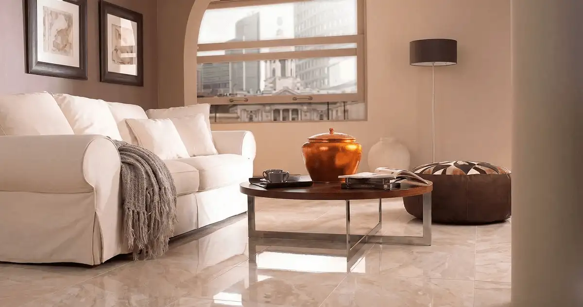 Modern living room with professionally installed marble flooring, a beige sofa, coffee table in Baton Rouge, LA