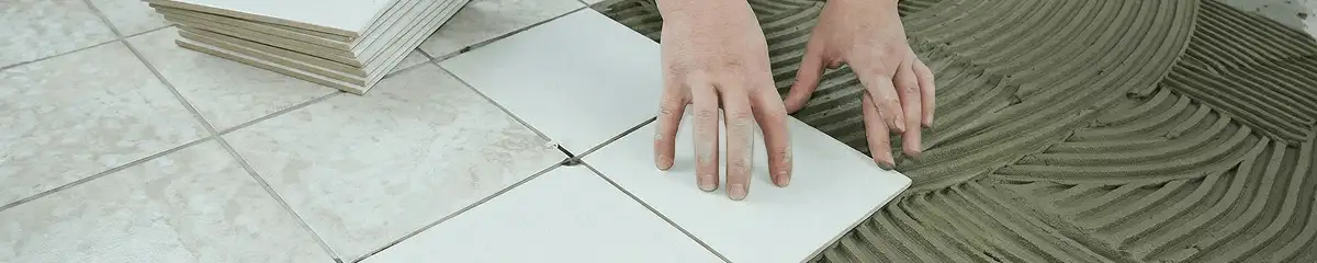 Professional installing white tile floors in Baton Rouge, LA