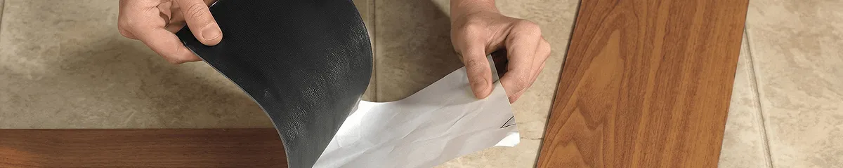 A professional installing vinyl flooring in Baton Rouge, LA